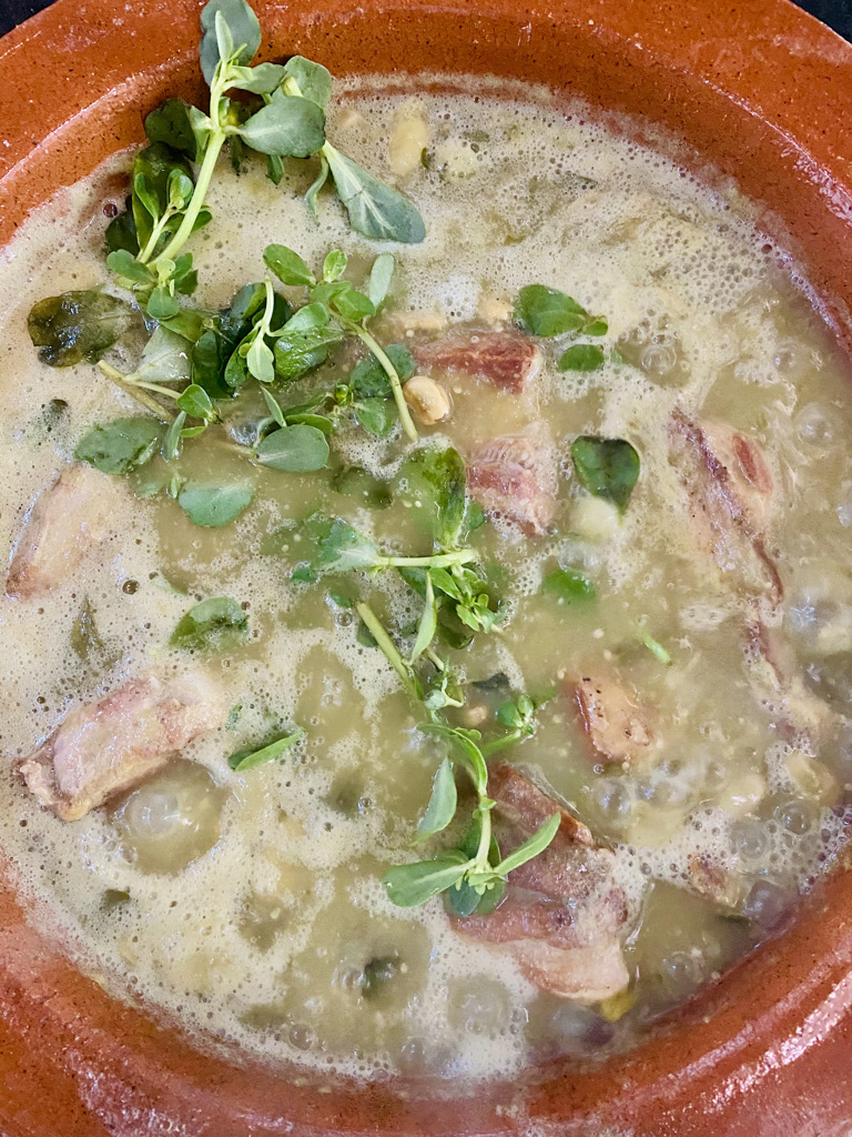 Pork ribs in salsa verde on the stove
