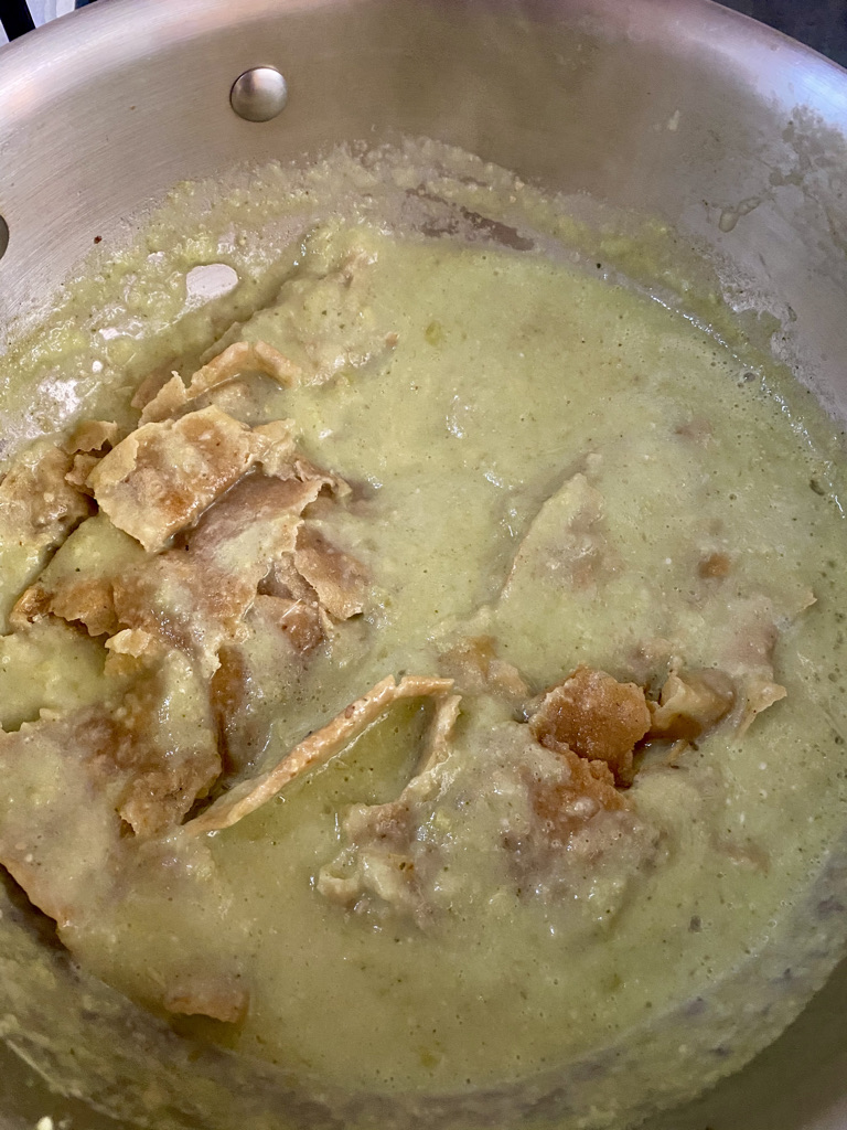 Tortilla pieces mixed with chilaquile sauce