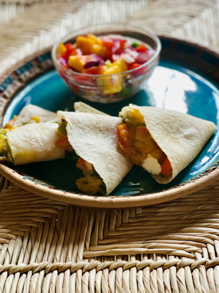 Plate of mini goat cheese quesadillas with mango salsa