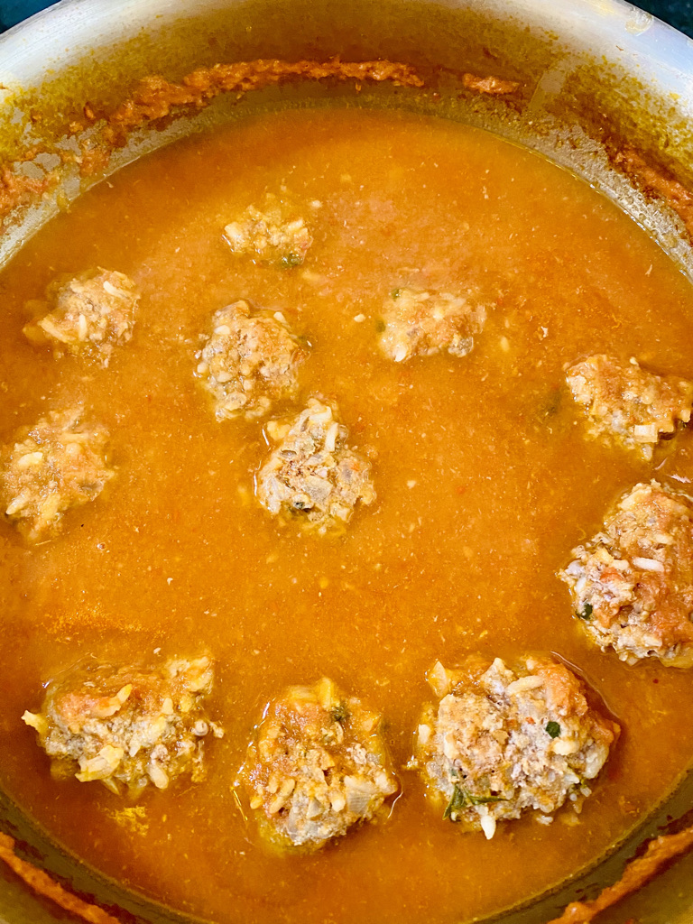 Mexican meatballs simmering in sauce