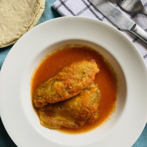 Stuffed squash blossom fritters in red sauce