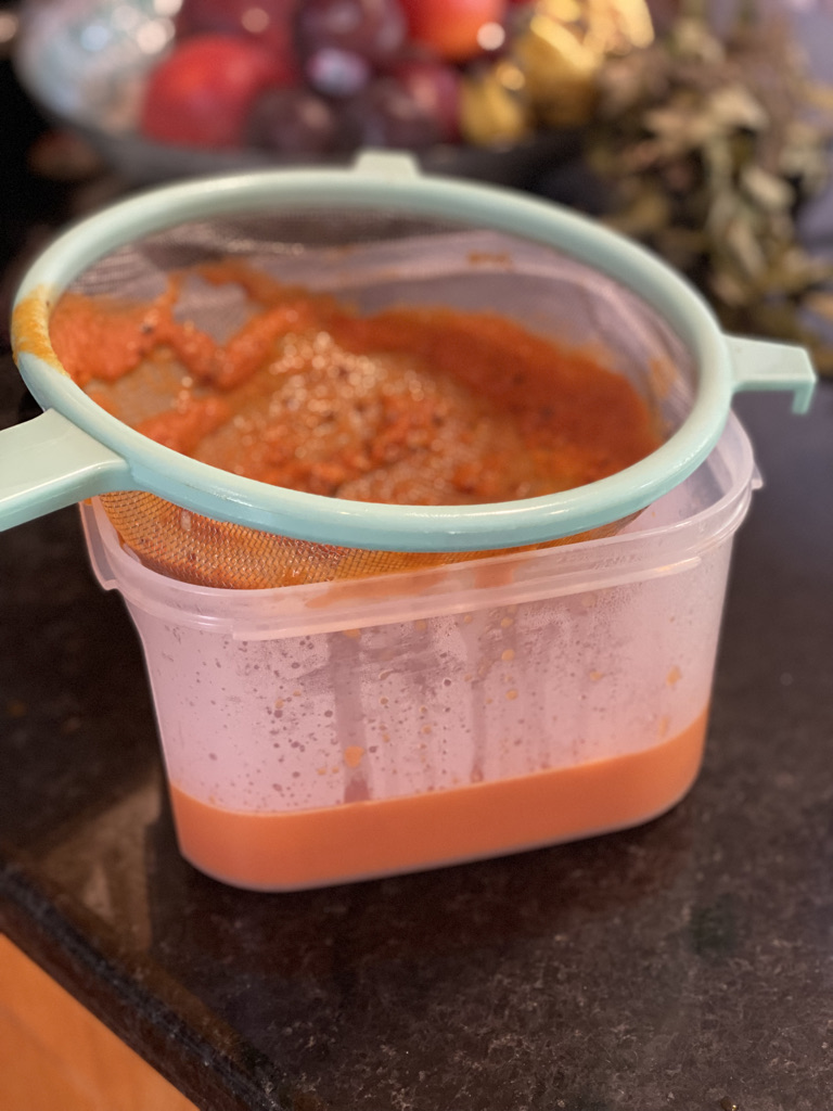 Straining the tortilla soup base