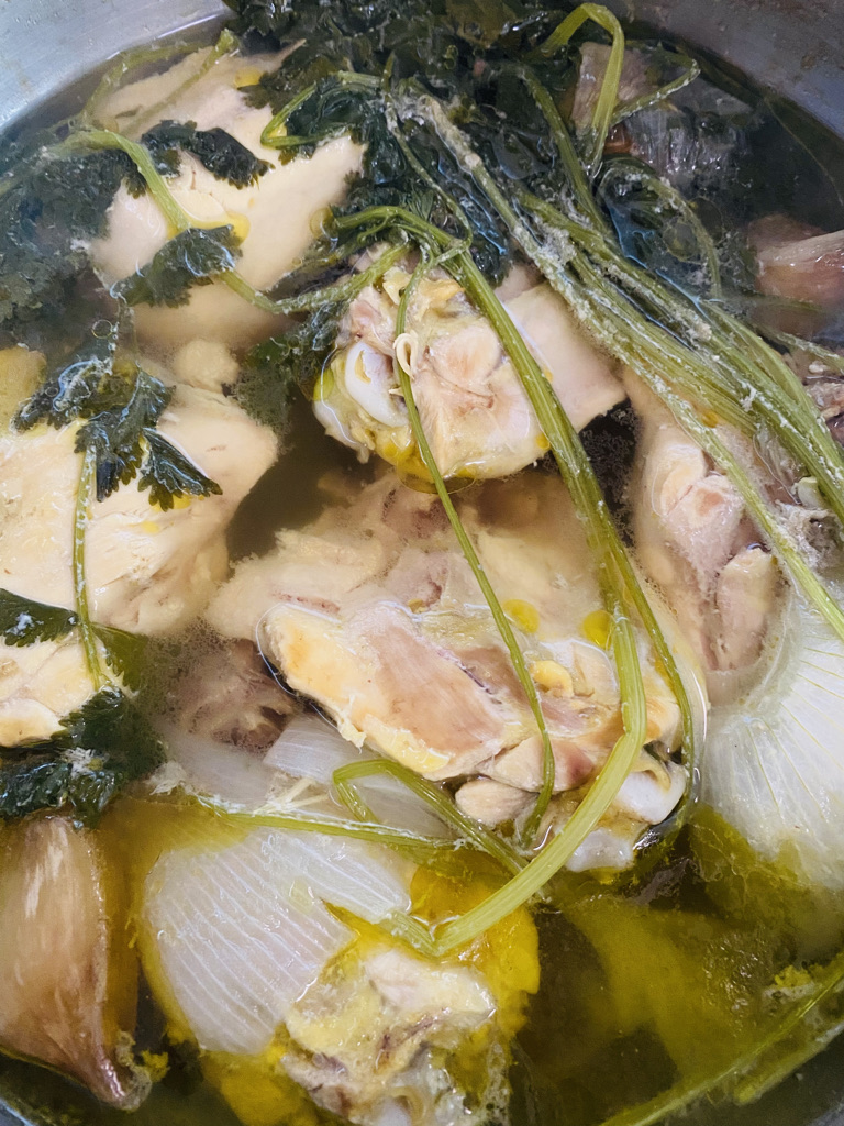 Cooked chicken broth for mole verde