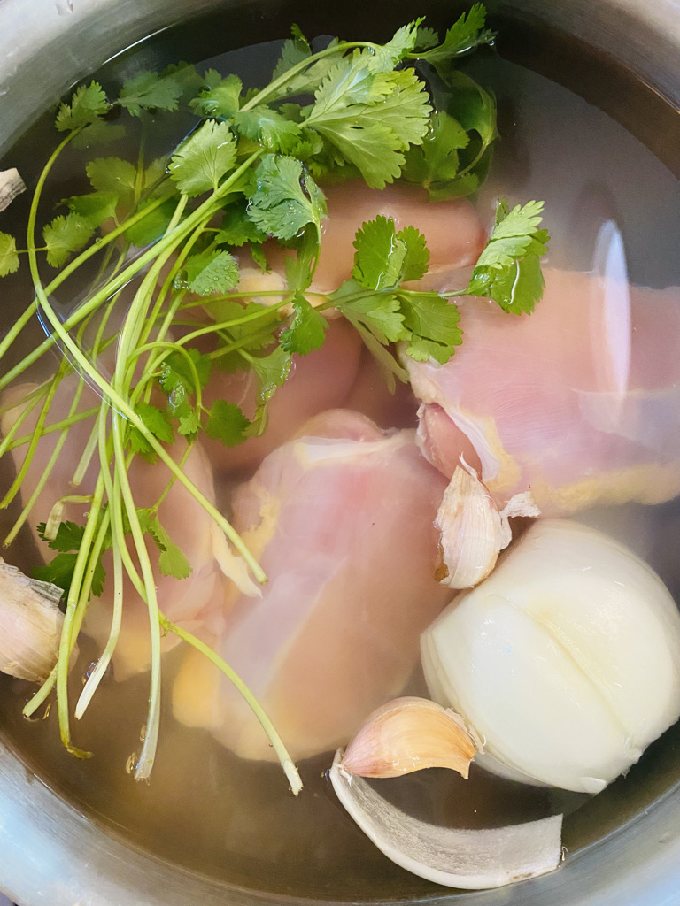 Chicken broth and chicken for mole verde
