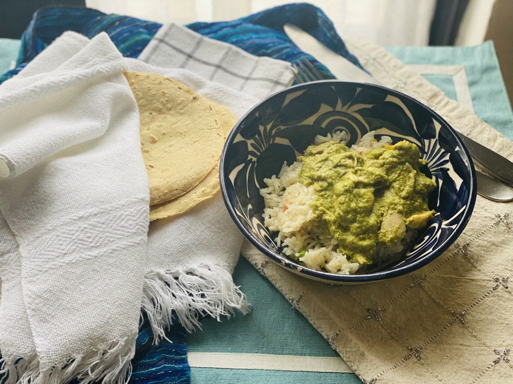 Mole verde with shredded chicken over rice