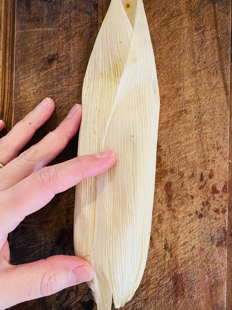 Fold corn husk sides down