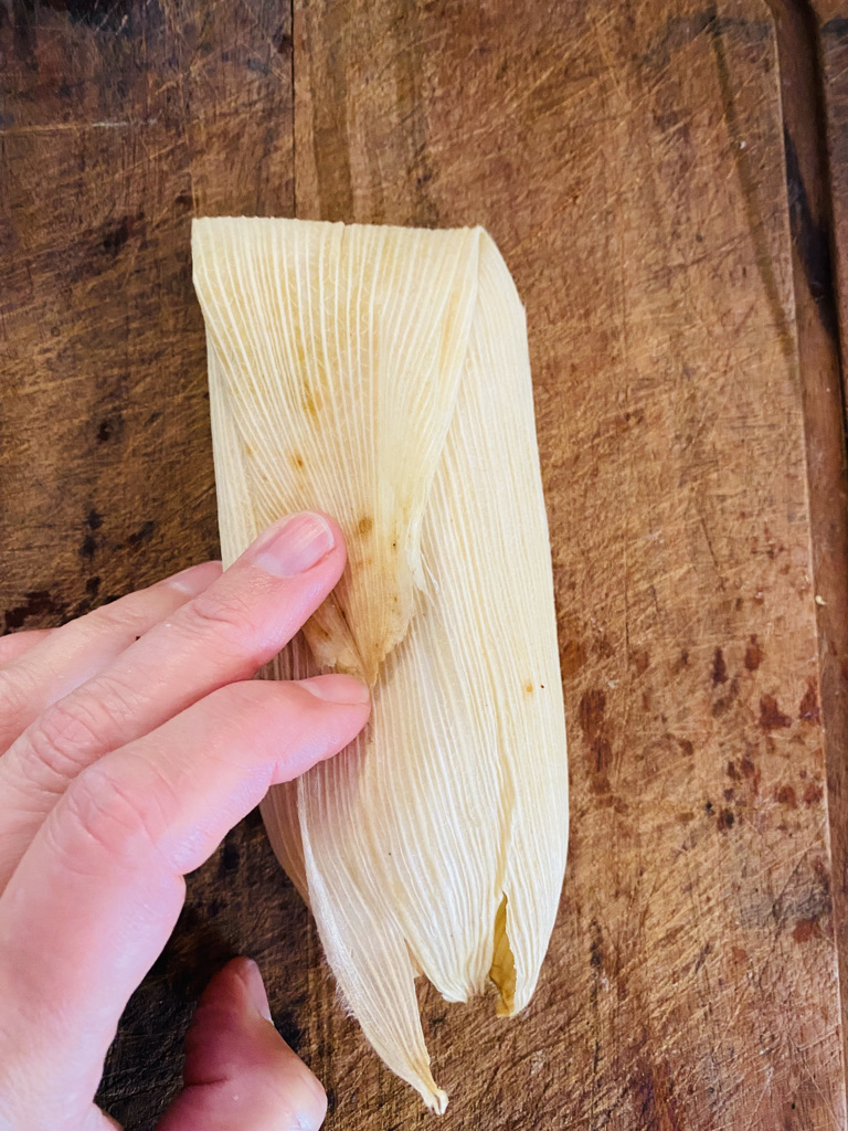Fold pointed end downwards