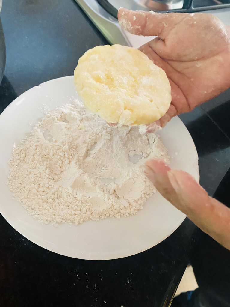 Hand shaping potato fritters