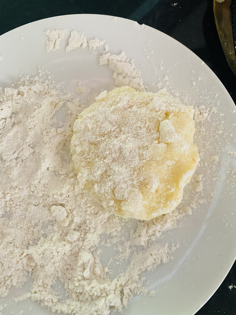 Potato cake coated with flour