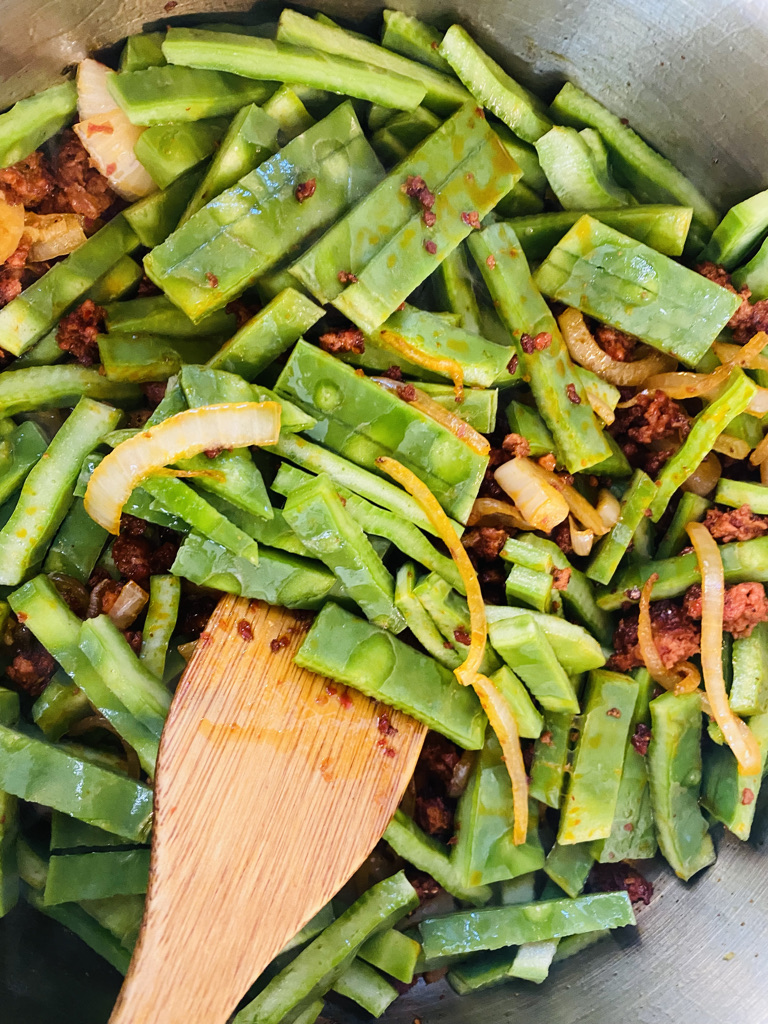 Chorizo, onions, and cactus frying in pan