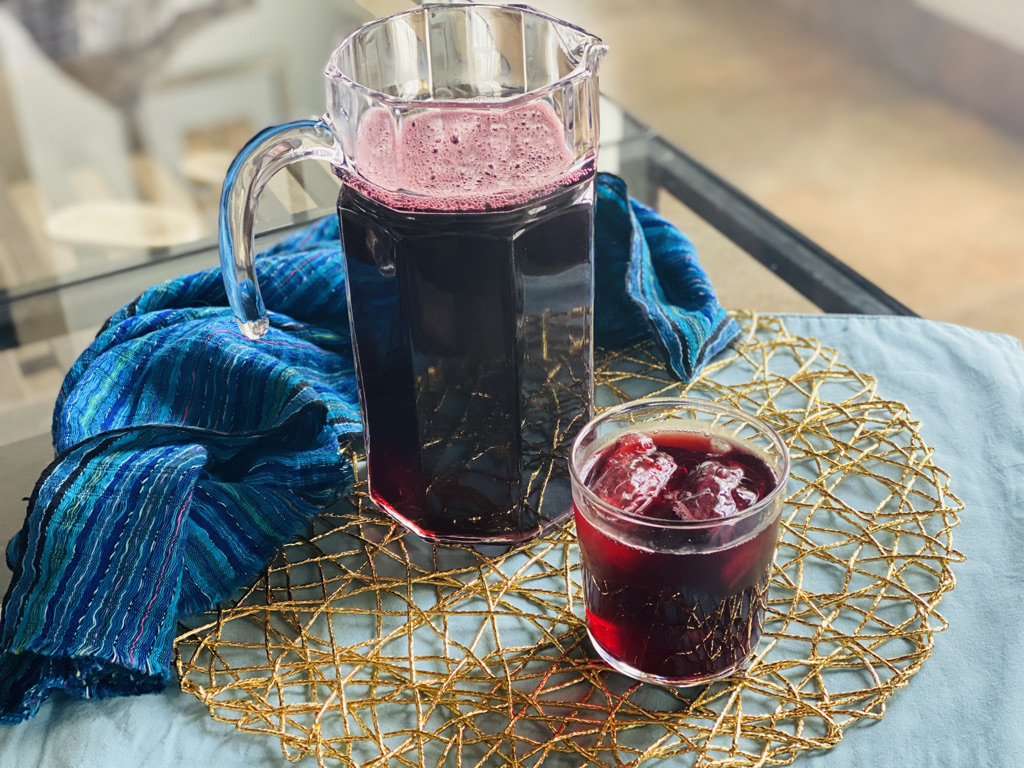 Pitcher and glass of agua de jamaica