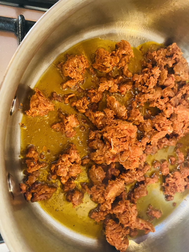 Chorizo frying in pan