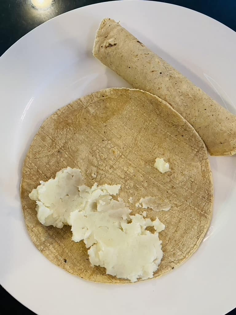 Rolling potato taquitos