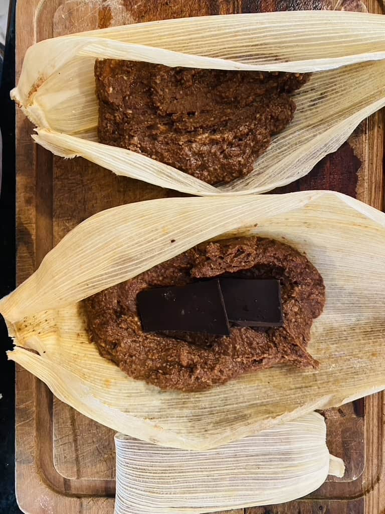 Chocolate masa and chocolate square in corn husks