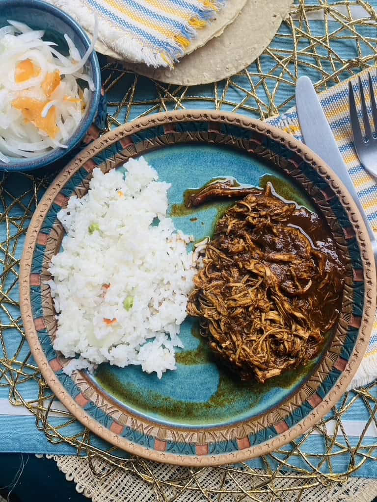 Saucy Mexican shredded chicken with pickled onions and habaneros