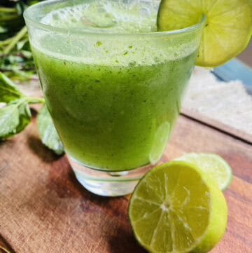 Glass of cucumber mint limeade made with spearmint