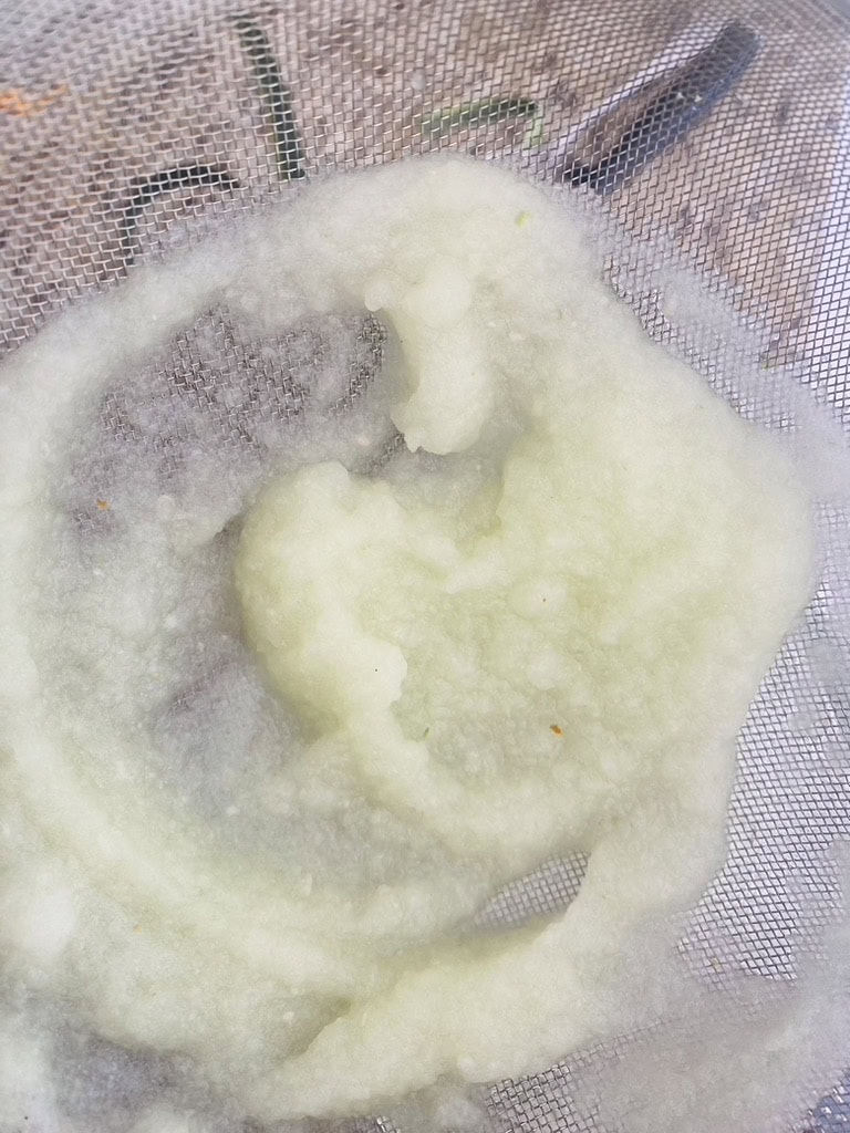 Cucumber pulp in a fine-meshed sieve