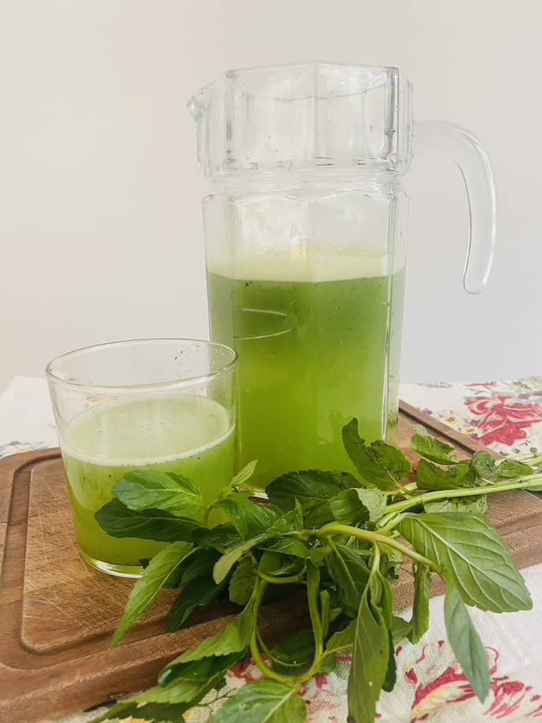 Cucumber mint limeade in a glass and in a pitcher