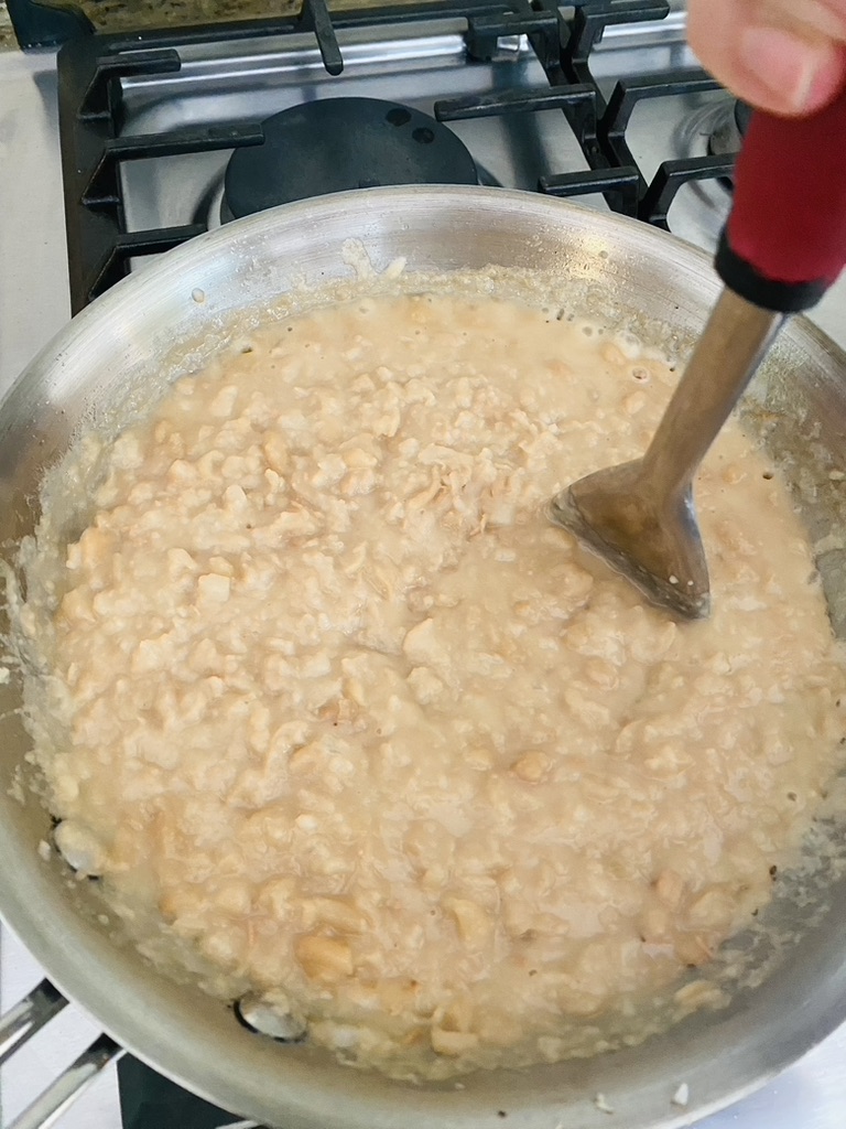 Creamy refried beans in a skillet