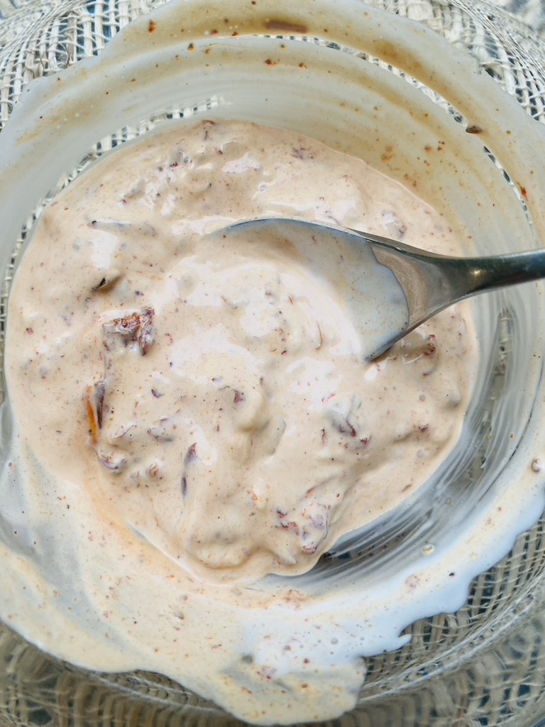 Chipotle crema sauce in a bowl with spoon