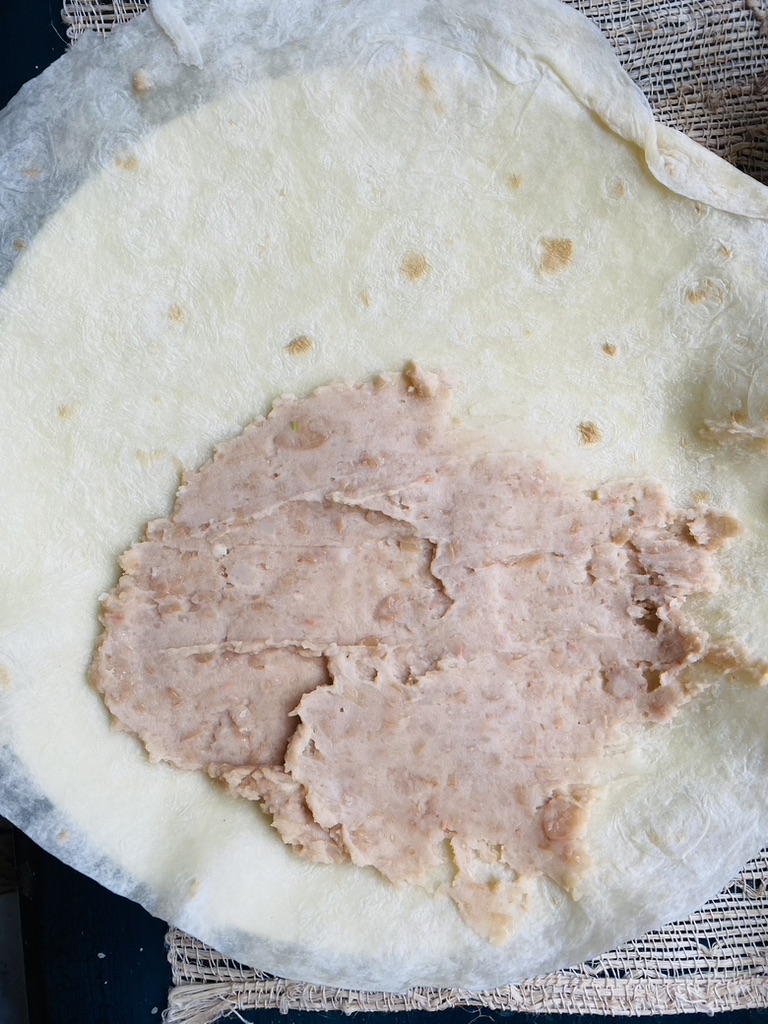 Flour tortilla with refried beans