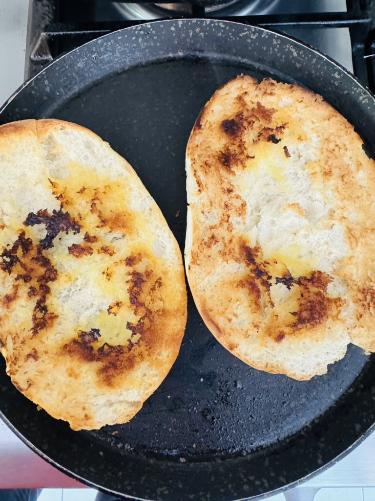Toasted telera bread in a skillet