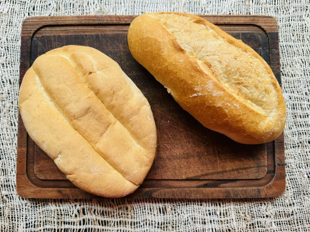 Telera and bolillo roll side by side