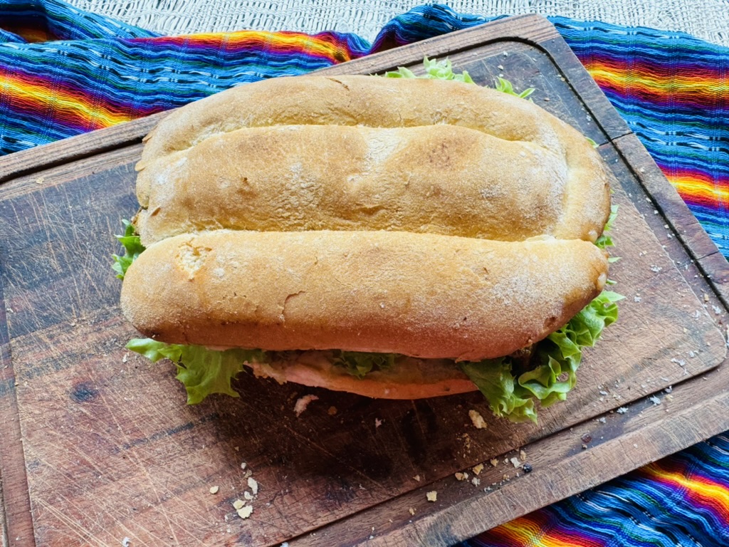 Whole torta on a wooden cutting board