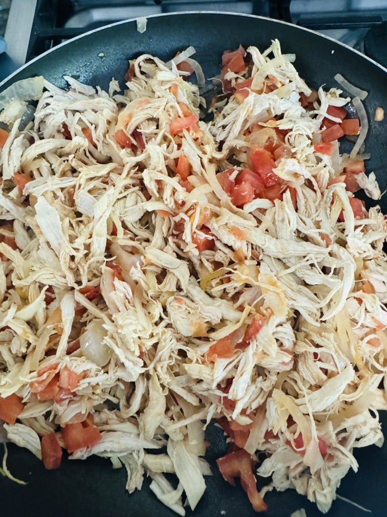 Pollo a la Mexican cooking in a non-stick skillet