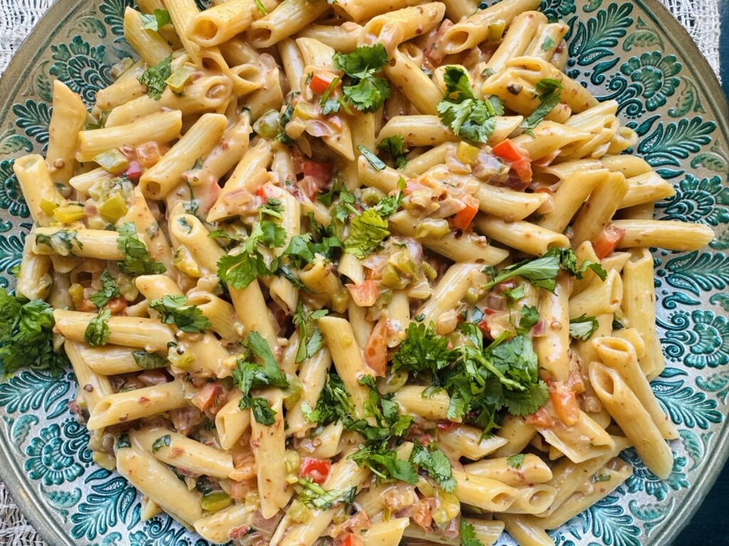 Creamy chipotle pasta in a large blue bowl