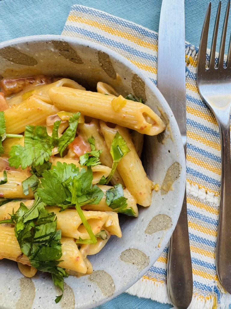 Small pottery bowl of creamy chipotle pasta