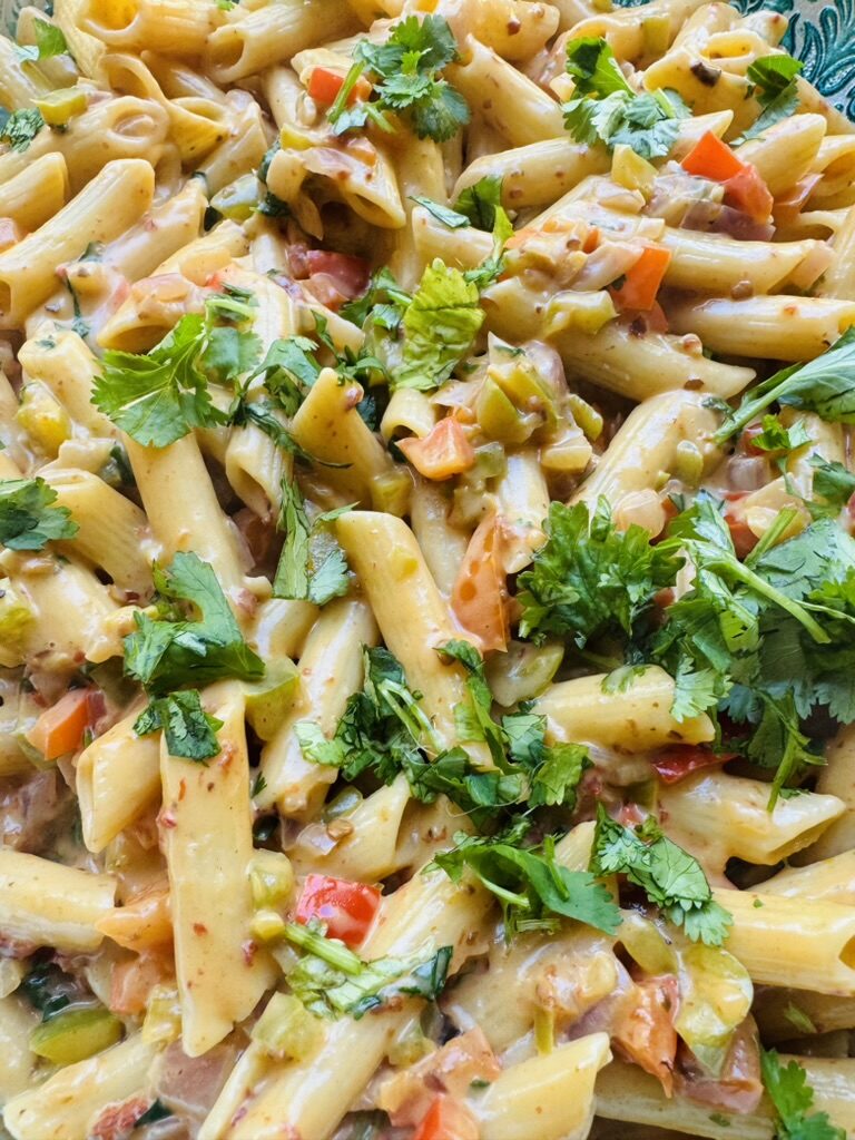 Close up of creamy chipotle pasta with cilantro garnish