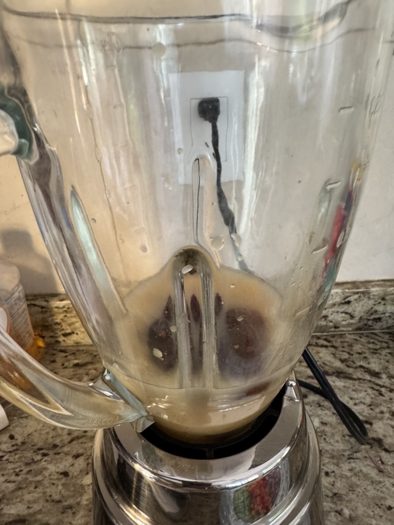 Chipotles and broth in a blender